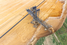 Giant hoisting crane eats into former farmland for the western expansion of the Garzweiler open-cast lignite mine in the district Immerath in Erkelenz in the state North Rhine-Westphalia, Germany from the plane