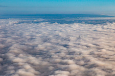 Aerial photograpy of Rotors of the wind farm near Offenbach rise above the low clouds in Offenbach an der Queich in the state Rhineland-Palatinate, Germany