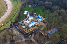 Aerial view of Herxheim forest outdoor pool without water in the pools in winter in Herxheim bei Landau in the state Rhineland-Palatinate, Germany