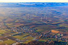 Wind farm in winter with a distant view over the Palatinate Forest in Freckenfeld in the state Rhineland-Palatinate, Germany