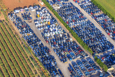 Aerial photograpy of Rows of stacked old vehicles at the Desguace Siglo 21 scrapyard in Dos Hermanas in the state Seville, Spain