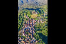 View of the village in the Northern Vosges from the west with the church of Notre-Dame-Marie-Auxilliatrice below the Château de Lichtenberg in Lichtenberg in the state Bas-Rhin, France