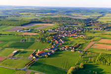 Village view from the southwest with ASI Avenir Football sports field in Adamswiller in the state Bas-Rhin, France