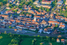 Town center at the train station with scaffolded church tower in Diemeringen in the state Bas-Rhin, France