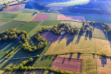 Aerial view of Meandering river course in the lovely Tauber valley in the morning from the west in the district Hochhausen in Tauberbischofsheim in the state Baden-Wuerttemberg, Germany