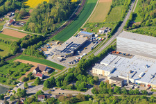 Aerial view of Refresco Deutschland GmbH and Autoservice Feuerstein in Grünsfeld in the state Baden-Wuerttemberg, Germany
