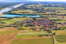 Village view from the north in front of the quarry lake/gravel works of Les Gravières Rhénanes SAS in Friesenheim in the state Bas-Rhin, France