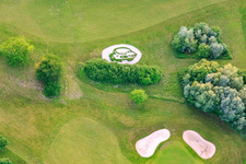 Bird's head-shaped hedge at Europa-Park Golf Club Breisgau in Herbolzheim in the state Baden-Wuerttemberg, Germany