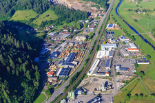 Aerial view of Industrial area on both sides of the B33 with Sägewerk Karl Streit GmbH & Co. KG, Kienzler Stadtmobiliar GmbH and Sievert Logistik SE in Hausach in the state Baden-Wuerttemberg, Germany