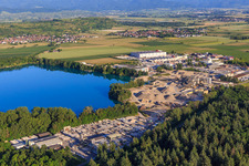 Aerial view of Rimsinger Baggersee / Niederrimsingen gravel pit with Betonwerk Müller GmbH & Co. KG, P & S-Beton GmbH & Co. KG and H+H Kalksandstein GmbH in the district Oberrimsingen in Breisach am Rhein in the state Baden-Wuerttemberg, Germany