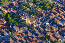 Village street with the church of Saint Cosmas and Damian in the district Jechtingen in Sasbach am Kaiserstuhl in the state Baden-Wuerttemberg, Germany