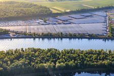 Aerial view of Industrial and Port Zone with CEVA Logistics car warehouse shaded by PV systems in Marckolsheim in the state Bas-Rhin, France