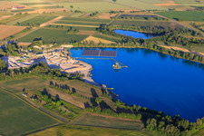 Aerial view of Wyhl gravel pit with floating PV system of Hermann Uhl KG - Wyhl-Ort plant in Wyhl am Kaiserstuhl in the state Baden-Wuerttemberg, Germany