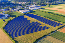 Open-space photovoltaic system in front of the Oberwiesachstraße industrial area in the district Betzweiler in Loßburg in the state Baden-Wuerttemberg, Germany