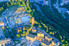 Geschwister-Scholl-Straße with water tower, VIA Horb eV and construction site at the former sports field on the Galgenberg in Horb am Neckar in the state Baden-Wuerttemberg, Germany