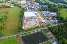 Oblique view of Construction site for the new logistics park of HANSAINVEST and DFI-Real-Estate Kandel after demolition of the OBI market in the district Minderslachen in Kandel in the state Rhineland-Palatinate, Germany