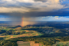 Aerial photograpy of Wind farm Merchingen in front of a rain wall with rainbow in the district Merchingen in Merzig in the state Saarland, Germany