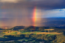 Wind farm Merchingen in front of a rain wall with rainbow in the district Merchingen in Merzig in the state Saarland, Germany seen from above