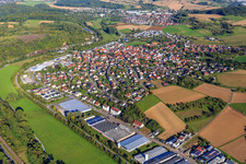View of the town on the Schwarzbach from the southeast and the industrial area with Geiß-Möbel, Rocholl GmbH and Helthosi GmbH in Eschelbronn in the state Baden-Wuerttemberg, Germany