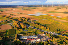Geothermal power plant Insheim for lithium extraction by Vulcan Energy GmbH in the background Rig V20 of Vercana GmbH and the Offenbach wind farm in Insheim in the state Rhineland-Palatinate, Germany from above