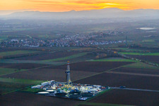 Vulcan Energy's V20 deep drilling site in the evening light at Schleidberg for the extraction of geothermal energy and lithium in Insheim in the state Rhineland-Palatinate, Germany from above