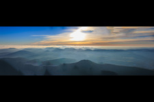 Panorama of the Palatinate Forest and the Northern Vosges Mountains in the evening haze in Nothweiler in the state Rhineland-Palatinate, Germany