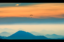 Aerial view of Paragliders over the Wasgau region in the evening in Fischbach bei Dahn in the state Rhineland-Palatinate, Germany