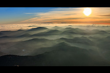Panorama of the Palatinate Forest and Northern Vosges Mountains in the evening haze in the district Blankenborn in Bad Bergzabern in the state Rhineland-Palatinate, Germany