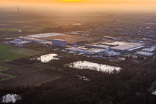 Interpark industrial park seen from the northeast on a foggy winter evening in Offenbach an der Queich in the state Rhineland-Palatinate, Germany