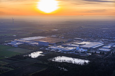 Aerial view of Interpark industrial park seen from the northeast on a foggy winter evening in Offenbach an der Queich in the state Rhineland-Palatinate, Germany