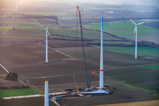 Aerial view of Giant crane for the repowering of the wind farm Minfeld. JUWI is replacing four old turbines (GE 1.5) from 2004 with two new, modern Vestas V162 turbines, each with six MW. in Minfeld in the state Rhineland-Palatinate, Germany