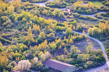 Paragliders over the hangars at the former military airfield Grostenquin in Bistroff in the state Moselle, France