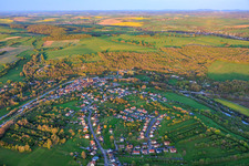 Village view in a bend of the Saar and Canal des Houillères de la Sarre (Saar Canal) in Wittring in the state Moselle, France