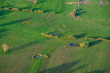 Circular waterholes in meadows in Grostenquin in the state Moselle, France