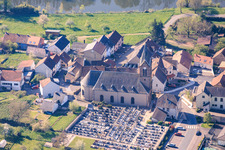 Church and cemetery on the banks of the Saar in Sarreinsming in the state Moselle, France