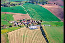 Village view from the east with a large farm in the south on the B85. in the district Neckeroda in Blankenhain in the state Thuringia, Germany