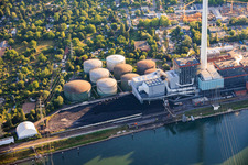 Oil tanks and coal heap of the GKM power plant Mannheim on the Rhine in the district Neckarau in Mannheim in the state Baden-Wuerttemberg, Germany