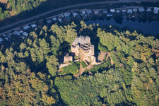 Neudahn castle ruins (scaffolded for renovation) overlooking the Neudahn Pond in Dahn in the state Rhineland-Palatinate, Germany