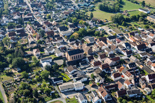 Ernst-Ludwig-Straße with Protestant Church Sickenhofen in the district Sickenhofen in Babenhausen in the state Hesse, Germany