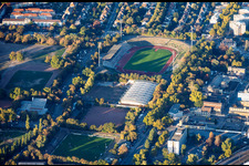 Südweststadion with a stand overgrown by bushes, and Sportpark Südwest in the district Süd in Ludwigshafen in the state Rhineland-Palatinate, Germany