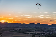 Paraglider in the evening light of the Southern Palatinate (Südpfalz) in the district Mühlhofen in Billigheim-Ingenheim in the state Rhineland-Palatinate, Germany