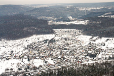 Wintry snowy Village - view on the edge of agricultural fields and farmland in Birkenfeld in the state Baden-Wurttemberg, Germany