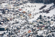 View of the town from the south on the edge of the Black Forest in winter with snow in the district Arnbach in Neuenbürg in the state Baden-Wuerttemberg, Germany