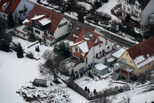 Aerial view of Mühlgasse in winter with snow in the district Gräfenhausen in Birkenfeld in the state Baden-Wuerttemberg, Germany