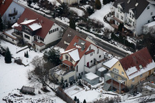 Aerial photograpy of Mühlgasse in winter with snow in the district Gräfenhausen in Birkenfeld in the state Baden-Wuerttemberg, Germany