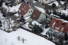 Mühlgasse in winter with snow in the district Gräfenhausen in Birkenfeld in the state Baden-Wuerttemberg, Germany from above