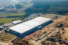 Construction of a new logistics hall in the Am Horst industrial estate in the district Minderslachen in Kandel in the state Rhineland-Palatinate, Germany seen from a drone