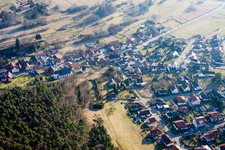 Aerial view of Village - view on the edge of agricultural fields and farmland in Schindhard in the state Rhineland-Palatinate, Germany