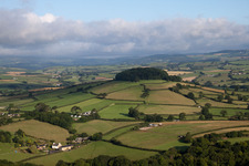 Typical hedged pastures, sometimes with unlocked gate to the sunken lane in Denbury in the state England, Great Britain