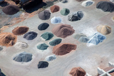 Piles of coloured gravel in the depot of Badische Terrazzo Handelsgesellschaft mbH in the district Neudorf in Graben-Neudorf in the state Baden-Wurttemberg